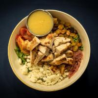 Grilled Chicken Bowl · Brown rice, arugula, sun-dried tomato, scallion, golden raisins, feta, choice of lemon vinai...