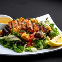 Grilled Salmon Salad · Field Greens, Fresh Dill, Capers, Roma Tomatoes, Radishes, Cucumber, Croutons, Shredded Parm...