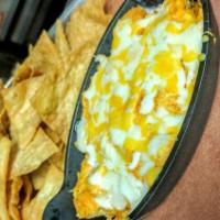BUFFALO CHICKEN DIP · Pulled chicken, Buffalo and cheese.
