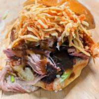 PULLED PORK · smoked pork, house BBQ, pickles, pickled red onions and brioche.