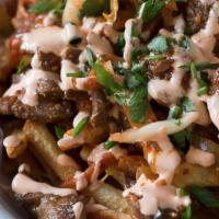 Kimchi Fries · Fries topped with spicy mayo, mild kimchi and choice of protein.