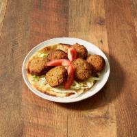 Falafel Sandwich · Mixture of garbanzo and fava beans, deep fried with spices and chopped parsley. Wrapped in p...