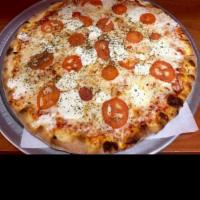 Margherita Pizza · Basil, tomato and fresh mozzarella.