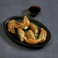2. Pot Stickers · Steamed or lightly fried spring roll wraps stuffed with chicken and vegetable. Topped with f...