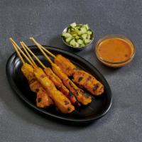 5. Chicken Satay · Chicken marinated in Thai spices, grilled on a skewer and served with peanut sauce and cucum...