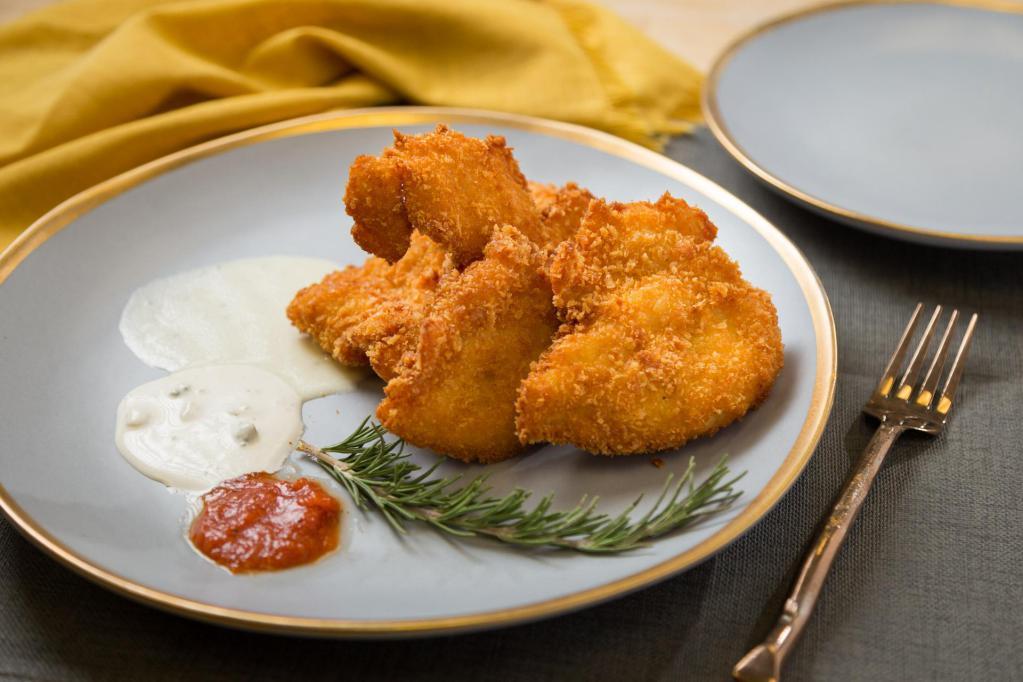 Chicken Fingers · Homemade-style golden brown breaded natural chicken tenders served with choice of sauce.