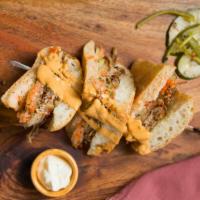 Bossa Banh Mi · Our version of the famous Banh Mi with slow roasted pulled pork, pickled carrots, turnip, cu...