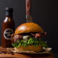 BBQ Bacon Burger · Charbroiled half pound Black Angus patty, white Cheddar cheese, bacon, red onions, lettuce, ...