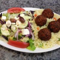 Falafel Platter · Served with choice of side, pita, salad and tzatziki.