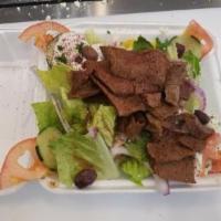 Gyro Salad · Greek salad with your choice of protein topped with tzatziki sauce.