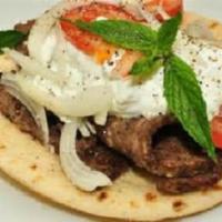Gyro Sandwich · Authentic Greek recipe. Choice of meat grilled with onions and topped with tzatziki sauce, l...