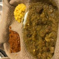 5. Yebeg Alicha · Lamb cubes simmered in a mild sauce  ginger and garlic sauce. Served with injera and two veg...