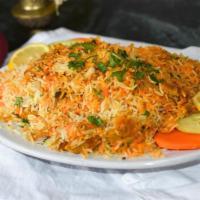 Chicken Biryani · Aromatic basmati rice and chicken cooked in tomato and onion sauce, delicately peppered with...