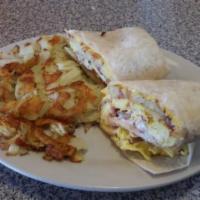 Breakfast Burrito · 3 scrambled eggs in a tortilla with cheese, salsa, sour cream and choice of breakfast meat. ...