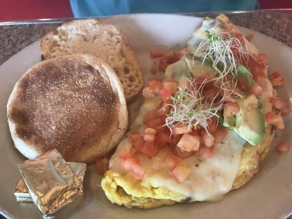 California Omelet · Bacon, avocado, sprouts and pepper Jack. 3 eggs topped with diced tomatoes. Served with a side of toast.