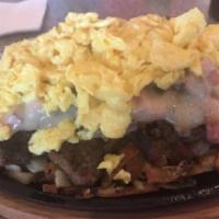 Meat Skillet · Bacon, ham, sausage, ground beef and cheddar served on a bed of hash browns with 2 eggs on t...