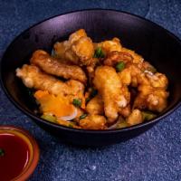 26. Sweet and Sour Chicken · Golden brown and crispy, flavored with pineapple bell pepper. Sauce aside. Served with steam...