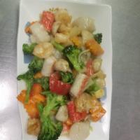 54a. Seafood Delight · Shrimp, scallop, crab meat, mushroom, snow pea and corn carrot etc. Distinctively seasoned w...