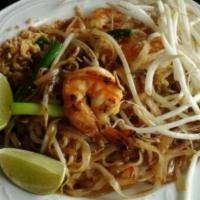 33. Pad Thai · Stir fried thin rice noodles with tofu, bean sprouts, scallions, egg and crushed peanuts.