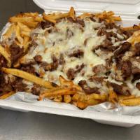 Philly Steak French Fries · Served with grilled onion, peppers, mushrooms, and melted cheese.