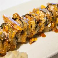 Mothra Roll · Inside: spicy tuna and deep fried. Outside: house sauce with tobiko, onion and sesame.
