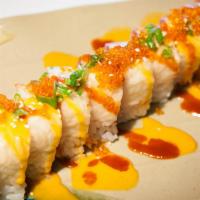 Giant Maki Roll · Soy wrapped sushi maguro, hamachi, ebi, sake, tobiko and avocado topped with tobiko, onion a...
