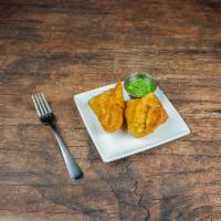 Vegetable Samosa · Two pieces. Potatoes stuffed in crispy wheat crust and deep fried.