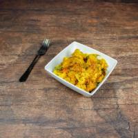 Aloo Gobi · Potatoes and cauliflower cooked in onions, tomatoes and mild spices. Served with rice. Vegan...
