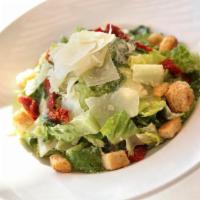 Classic Caesar · Romaine hearts tossed with focaccia croutons, house made classic Caesar dressing, garnished ...