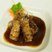 11. Beef Enoki · Sliced steak wrapped with enoki in special BBQ sauce.