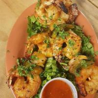 6 Grilled Shrimp · Jumbo shrimp marinated with Cajun seasoning, saffron, olive oil and lemon juice.
