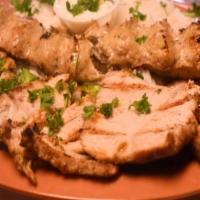 Chicken Barg · 2 chicken breasts marinated in lemon juice, olive oil, garlic, saffron and spices. Grilled a...