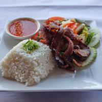 Pork Chop on Rice · Deep fried pork chop, green onion sauce, kim chi khmer style, cucumber, tomato and house spe...