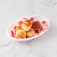 15. Garlic Knots with Sauce · 5 pieces.