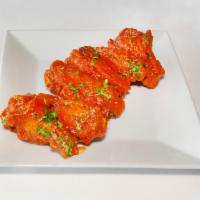 Buffalo Wings · Deep fried chicken wings served with your choice of two sauces.