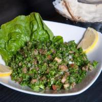 Tabouleh Salad · Finely chopped parsley, tomato, onion and bulgar wheat tossed in fresh lemon juice and olive...