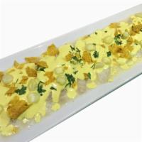 Tiradito Ceviche · White fish marinated with lemon juice, huancaina sauce, peruvian corn, sweet potato chips an...