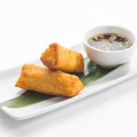 Egg Rolls · Two pieces. Hand-rolled with marinated pork and vegetables.