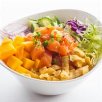 Citrus Salmon · Salmon poke with mojito lime sauce, cucumber, lettuce, mango, sweet onions, wonton chips, sc...