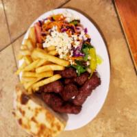 Inegol Kofte Dinner · Specially seasoned grilled meatballs. Served with a Greek salad and a side of Rice