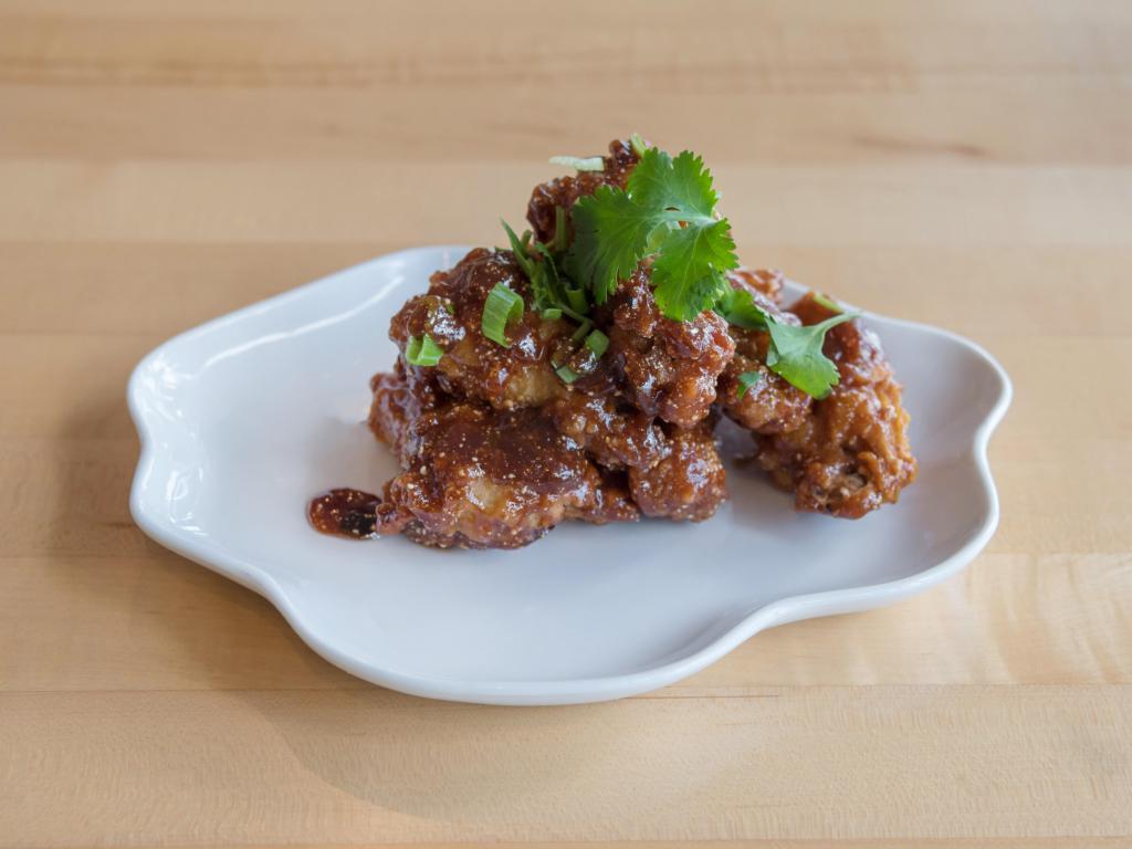 6 Piece Bangkok Wings · Golden chicken wings marinated in Thai style and deep fried. Served with house sauce. Spicy.