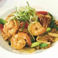 Kahri Noodles · Wide rice noodles with egg, onions, bell peppers, milk, curry powder and shrimp. Spicy.