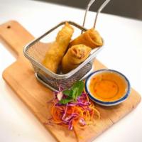3 Piece Egg Rolls · Crispy fried spring rolls filled with mixed veggies. Served with sweet and sour sauce.