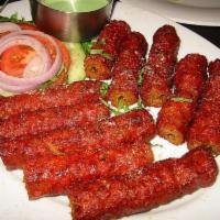 Lamb Seekh Kebab · Ground lamb cooked in tandoor with Indian spices.