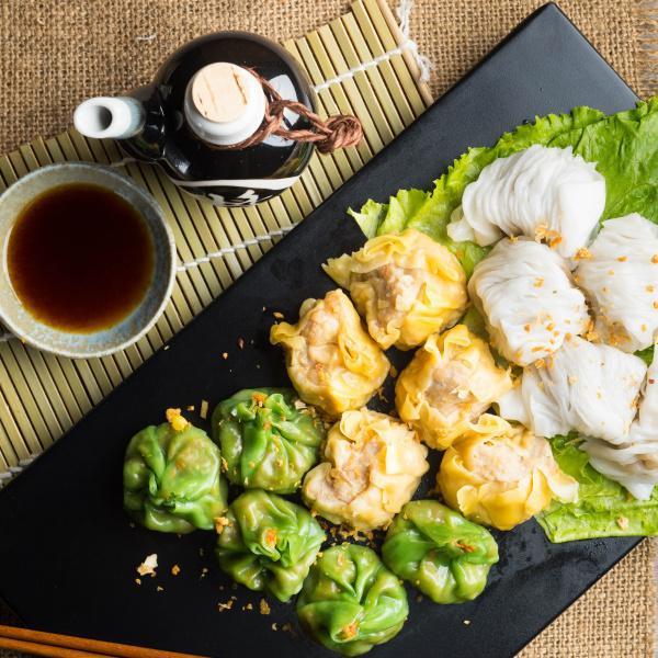 5 Steamed Vegetable Dumpling · Served with garlic soy sauce.