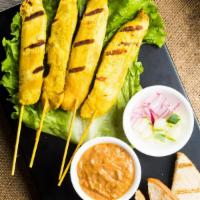Chicken Satay · 4 piece. Marinated in Thai herbs and grilled on skewers with home made peanut sauce.