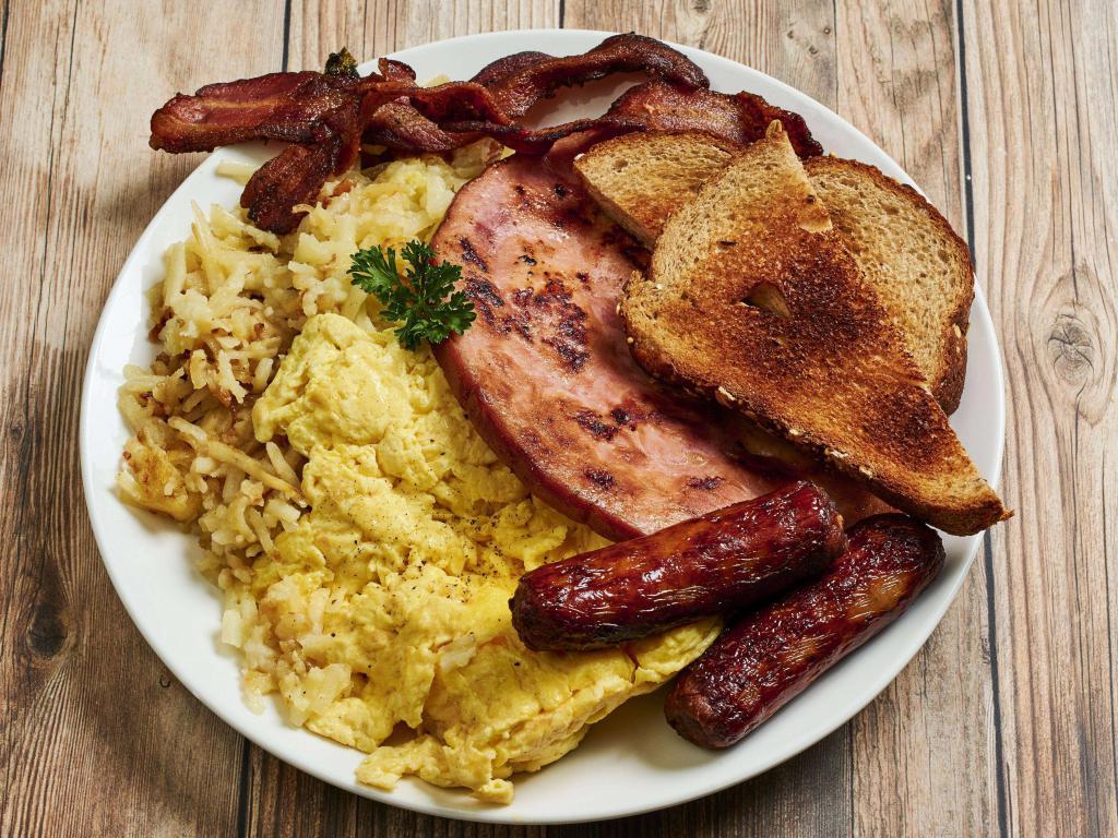 All-American Breakfast · 2 eggs any style, 2 strips of bacon, 2 sausage links, a ham steak and your choice of potatoes or fruit and toast or bagel.