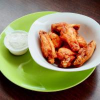 Wings · Served with your choice of sauce and a side order of our dressing.