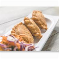 Curry Puff · Thai pastry stuffed with potato, onion and yellow curry paste.