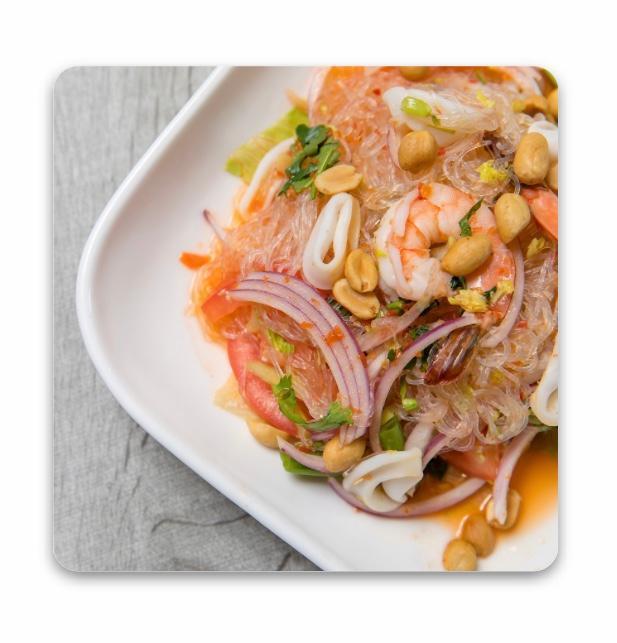 Yum Woonsen Talay · Shrimp, scallop, squid, cellophane noodles, exotic spices, fried garlic, and roasted peanuts.